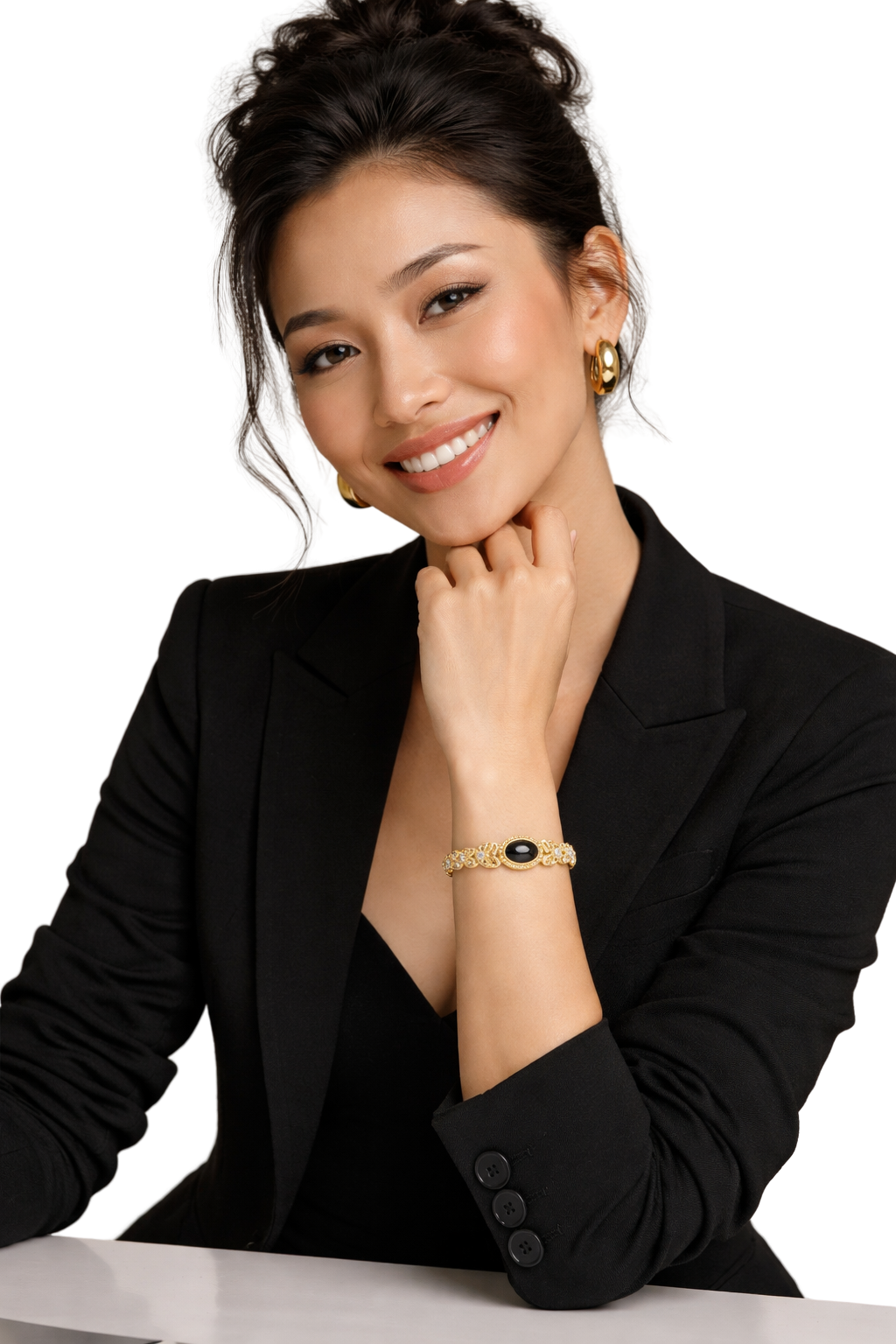 Gold bracelet and hoop earrings